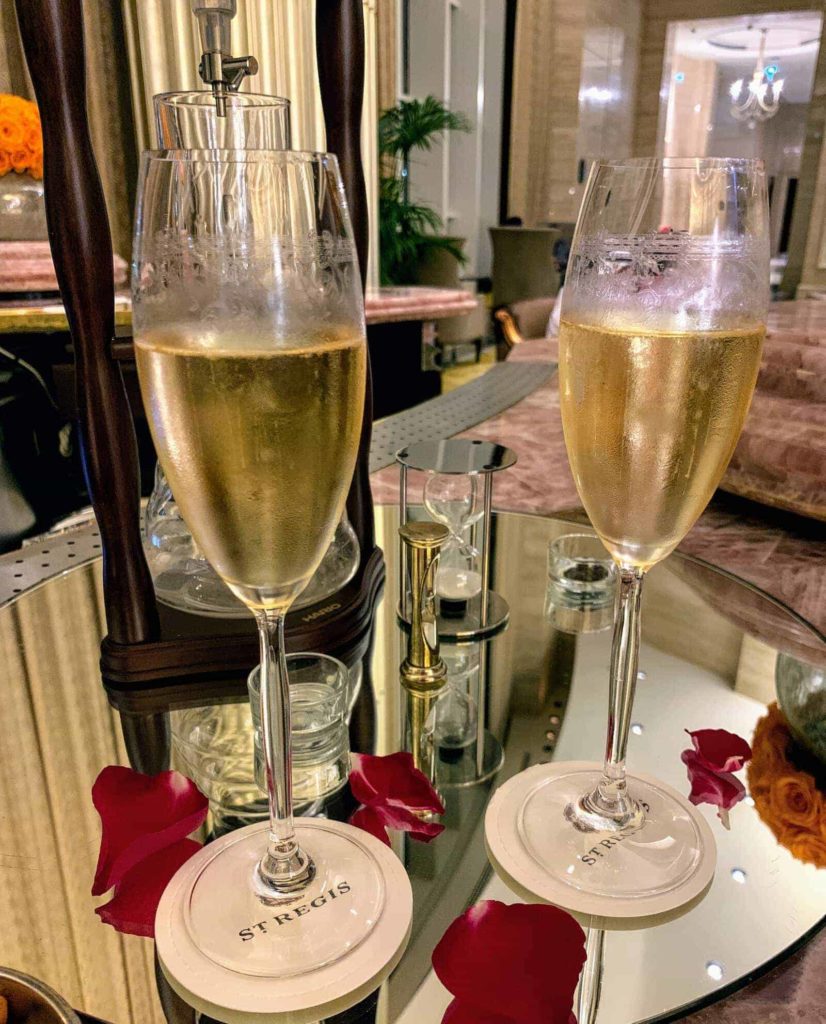 Book a flight with a price error with ITA Matrix - champagne glasses at the bar