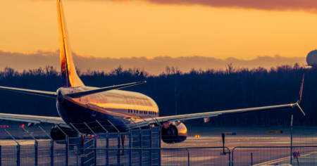 Fuel Surcharges and Price Increases: Which Airlines Have Announced New Costs? - airplane on tarmac at sunset
